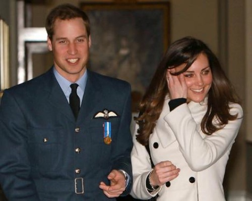 Britain's Prince William smiles as he walks with his girlfriend Kate Middleton at RAF Cranwell, central England