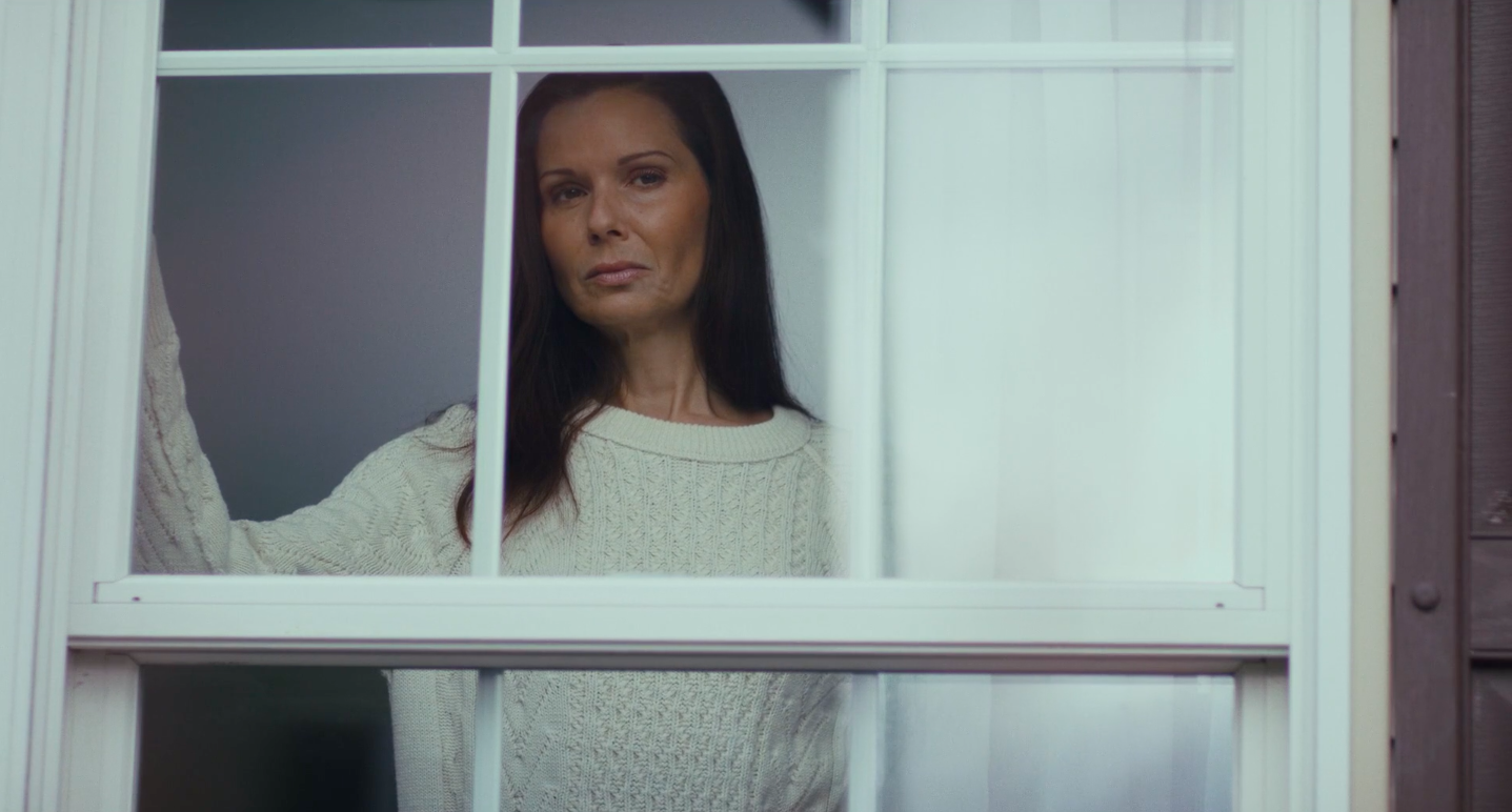 Linda (Florencia Lozano) in window from _Life After You_