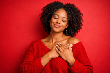 Black woman holding heart